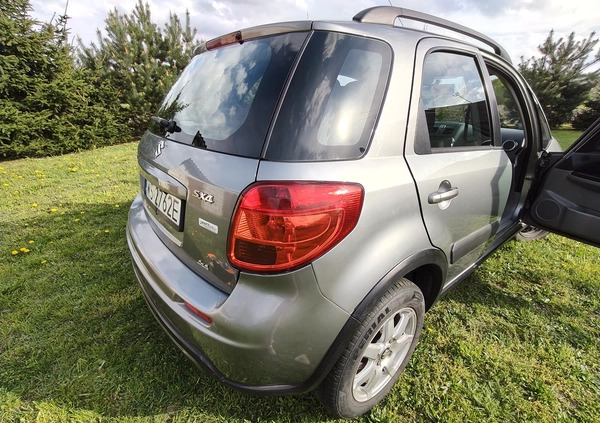 Suzuki SX4 cena 34500 przebieg: 135140, rok produkcji 2013 z Szczecinek małe 211